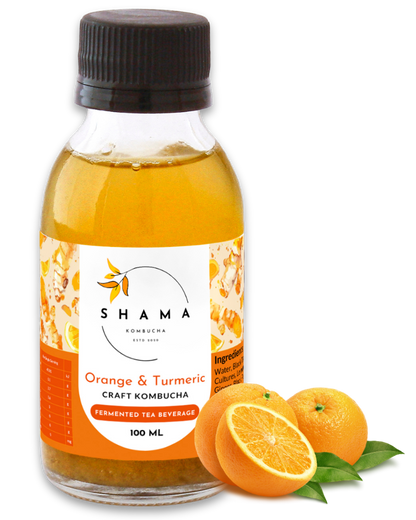 100ml Bottle of Orange & Turmeric Kombucha with sliced oranges